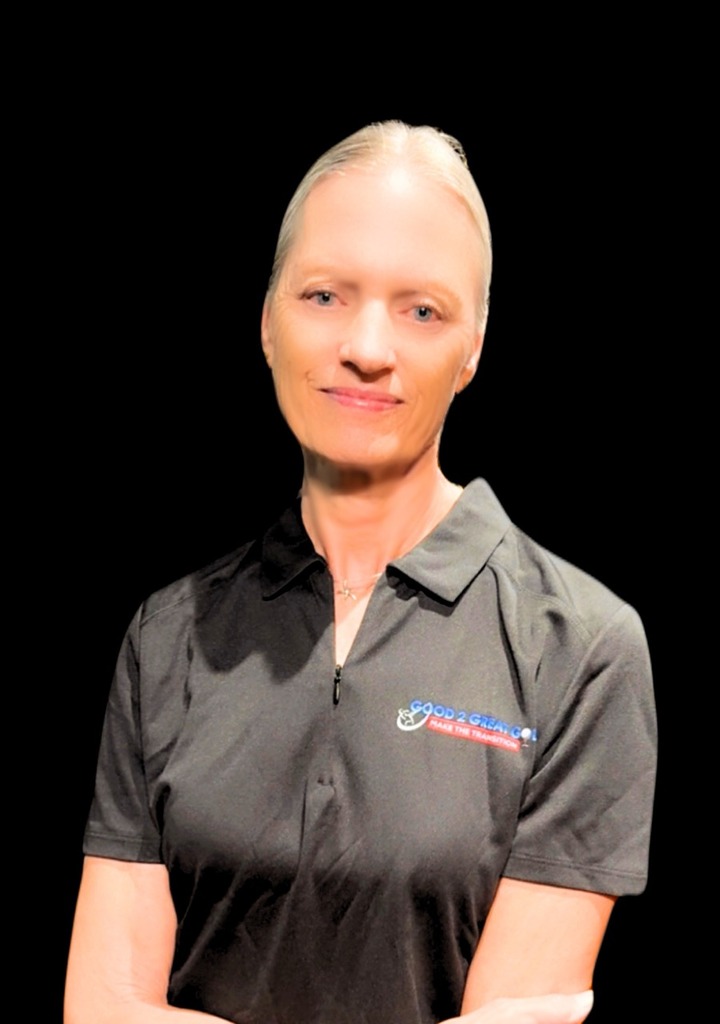 woman in charcoal colored polo